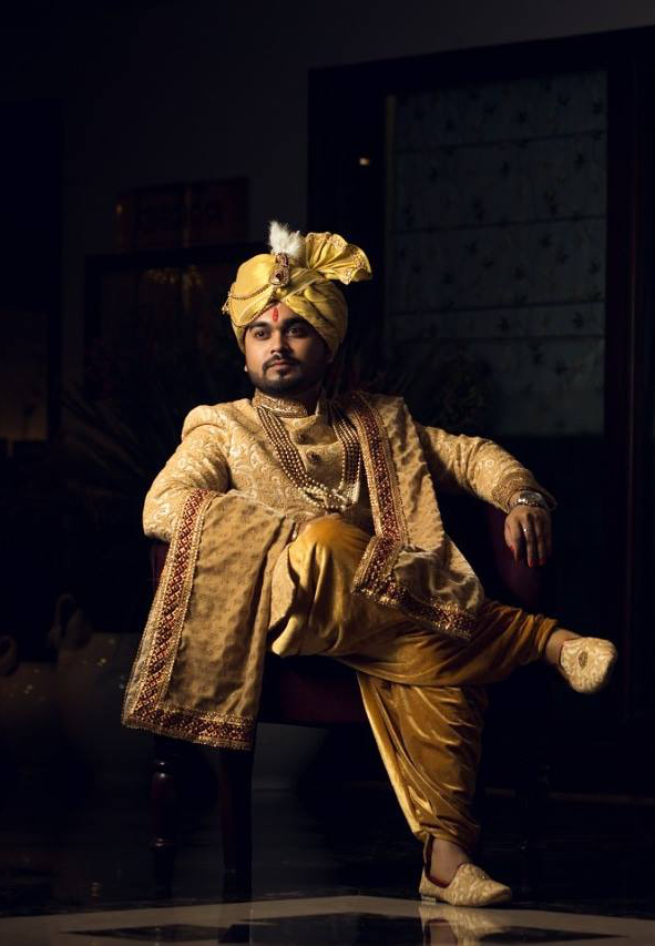 Manav Ethnic Happy Customer wearing a Royal Golden Sherwani