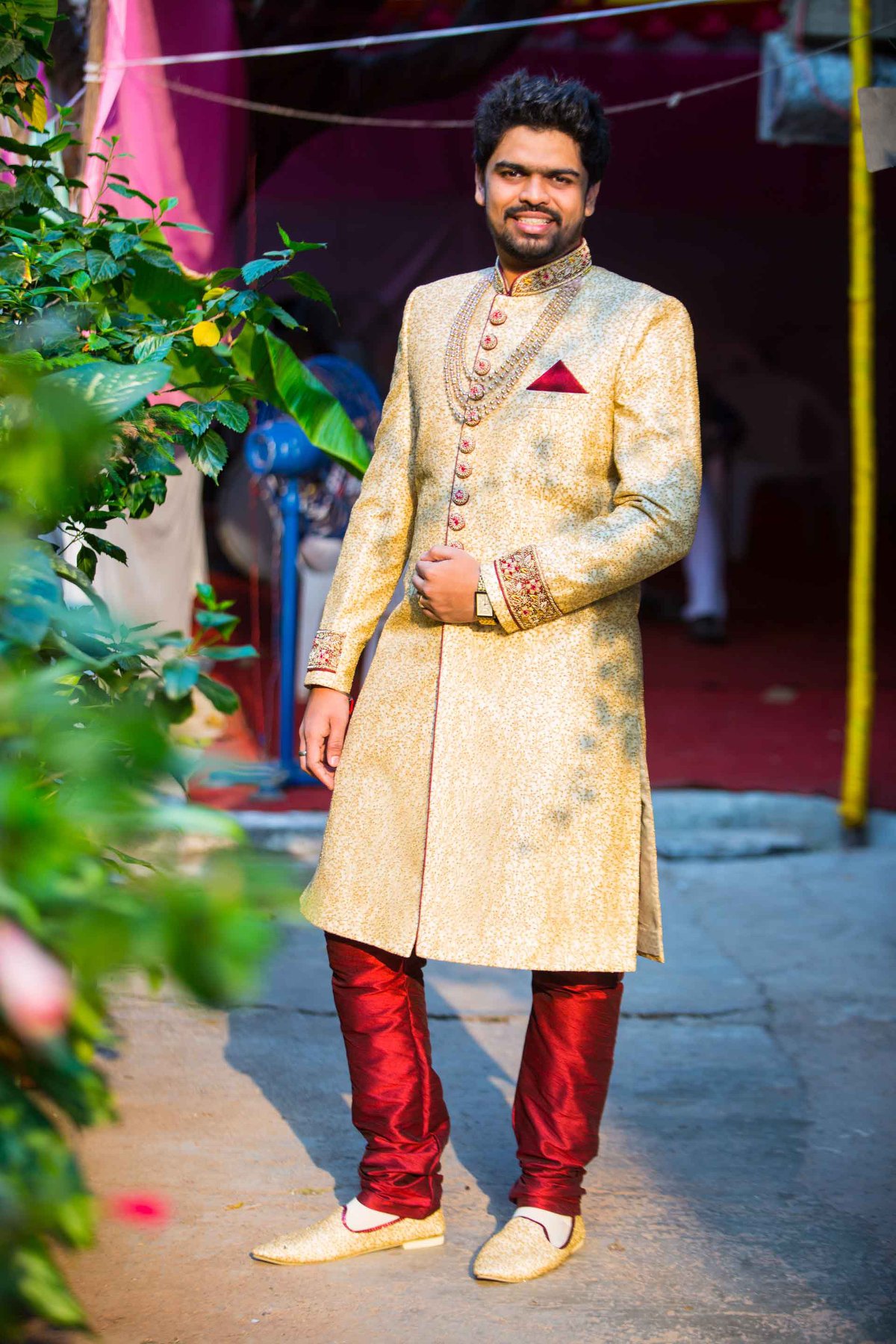 Manav Ethnic Happy Customer wearing a Golden Indo Western