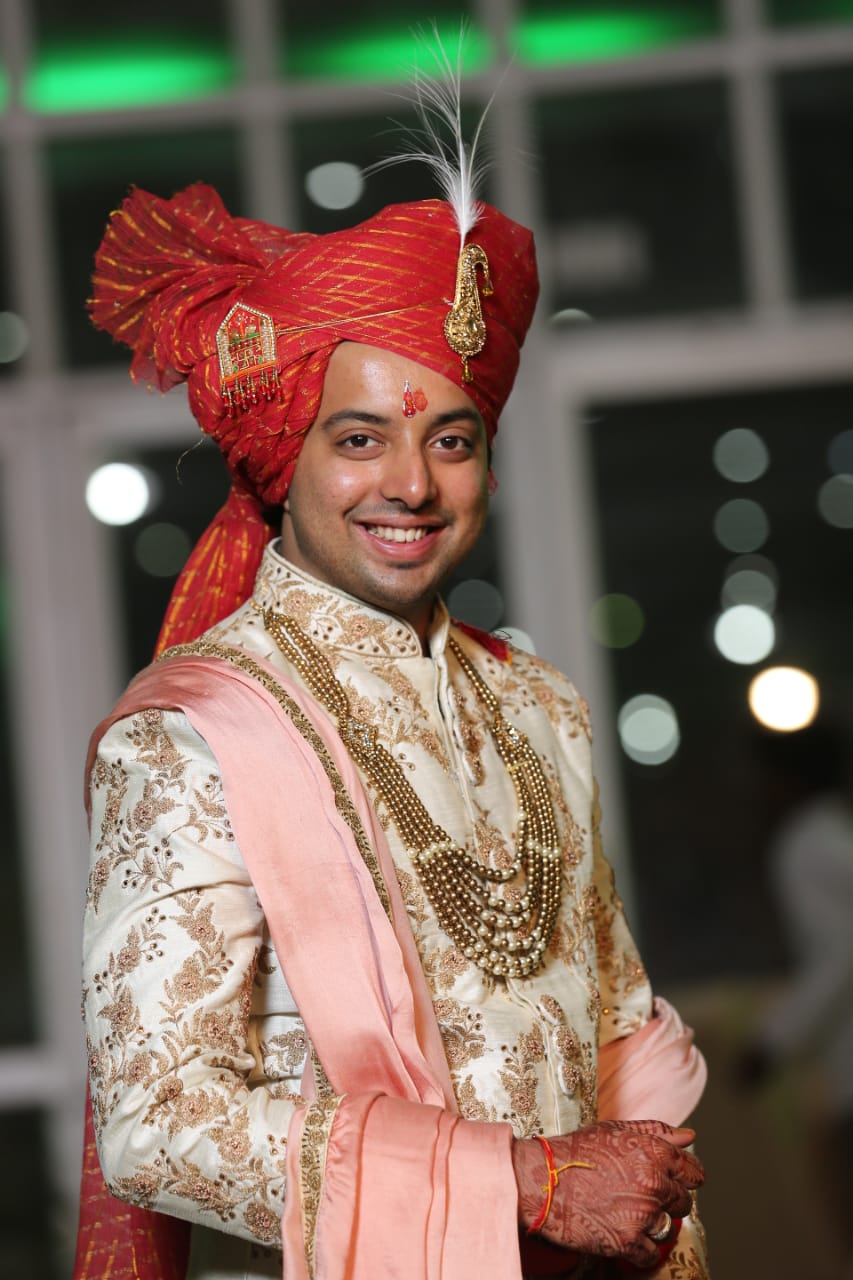 Manav Ethnic Happy Customer wearing a Royal White Sherwani